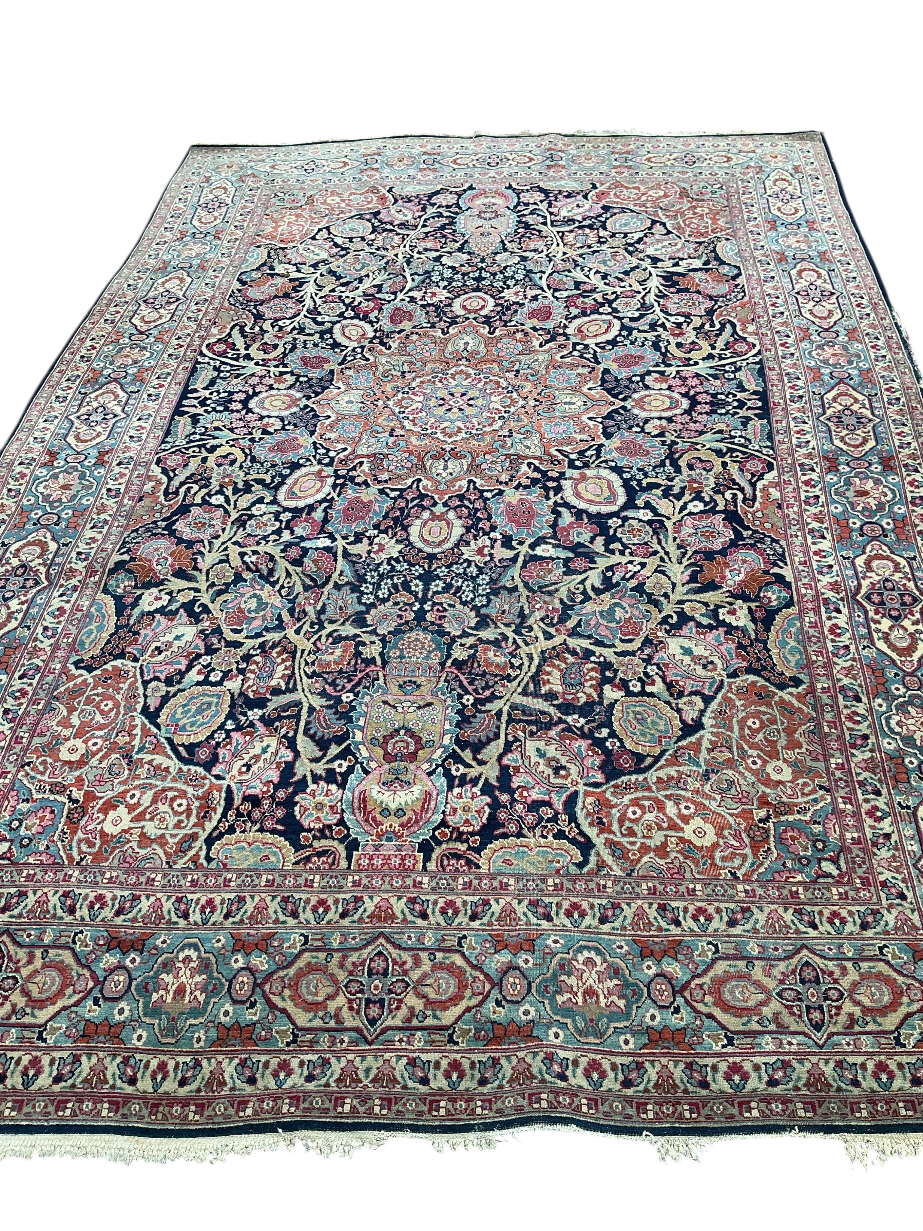 An early 20th century Kashan blue ground carpet, 315 x 206cm